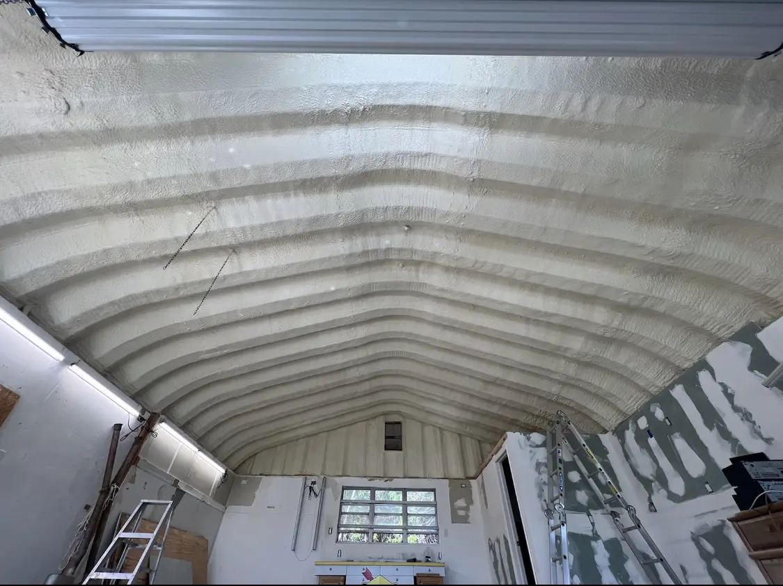 Spray polyurethane foam applied to the underside of a metal roof deck in Edinburg